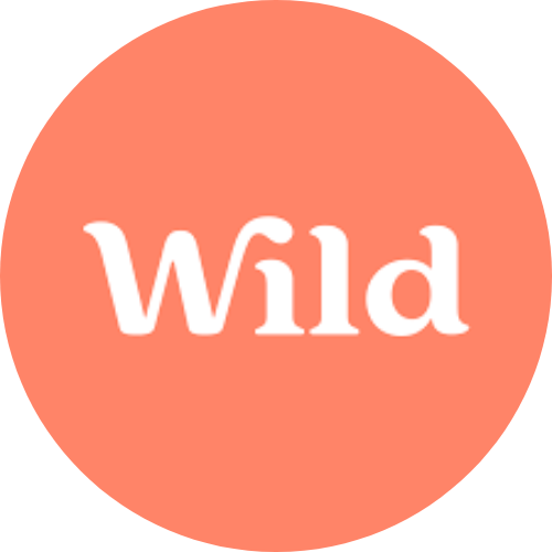 The Wild Deodorant logo: there is some curly text that says 'Wild' in front of a plain peach background